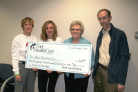 Spin to Win Check presentation to Rock River Free Clinic