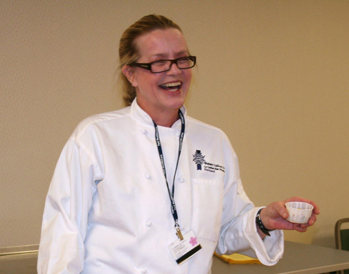 executive chef colleen miller presenting to a group of patients