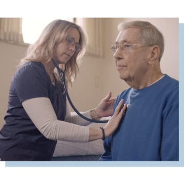 Cardiology tech checking a patient